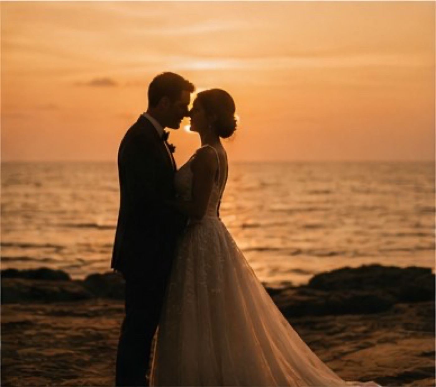 Silhouette engagement portrait against the Lake Erie sunset in Cleveland
