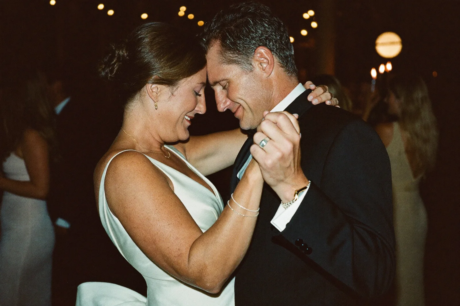 First dance at a warm candlelit wedding reception