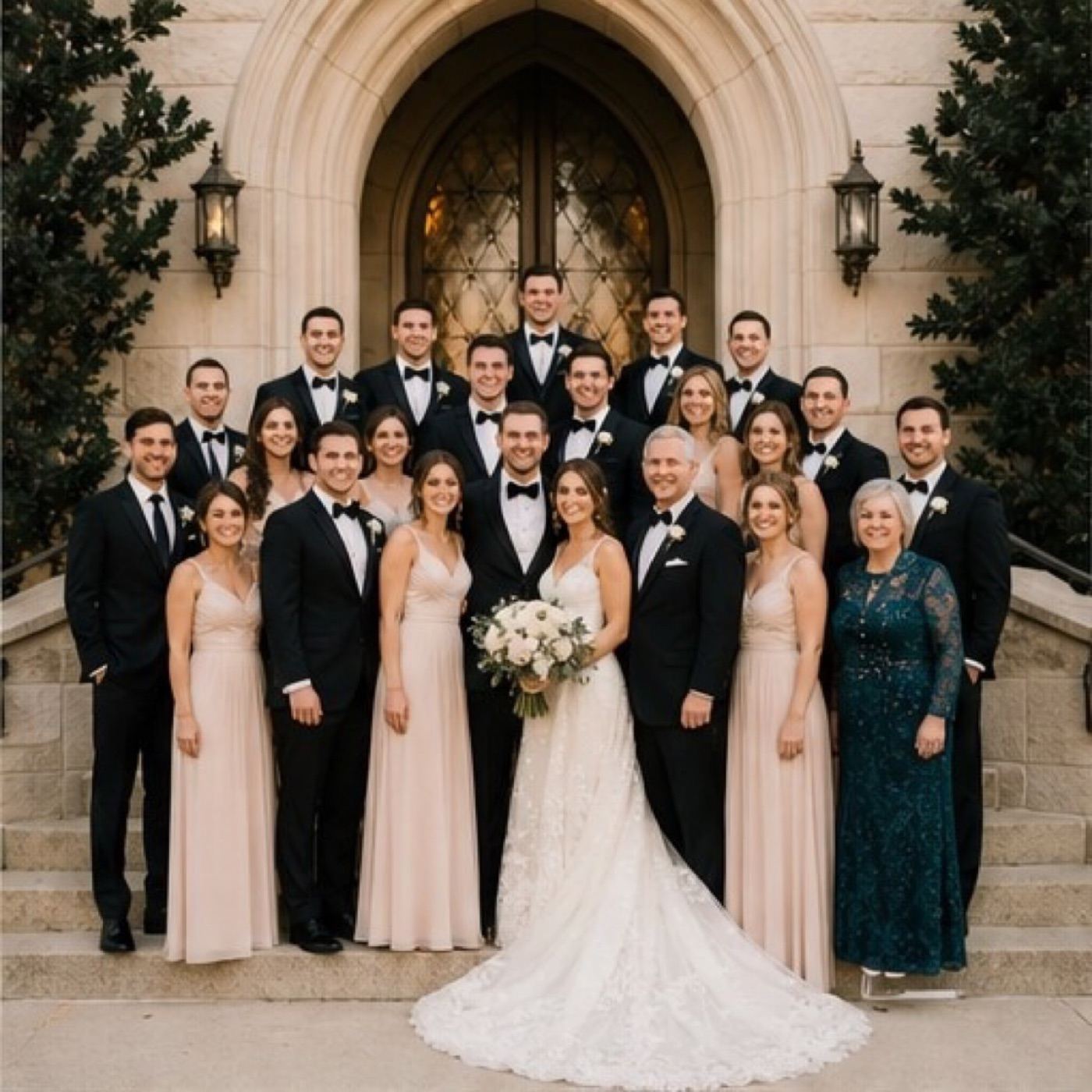The wedding party on the steps